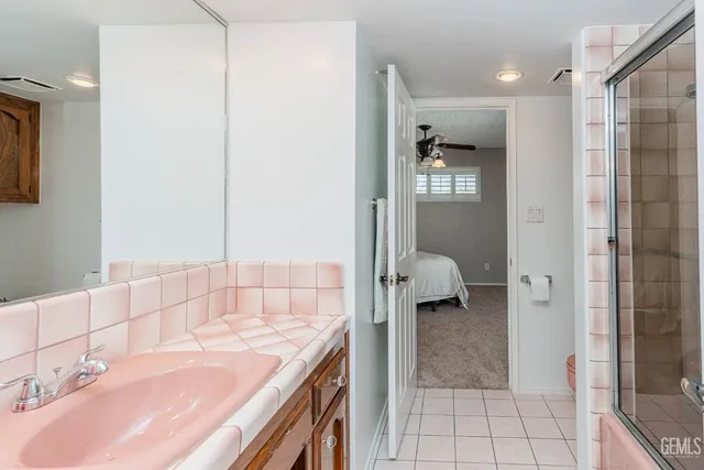 a bathroom with a sink and a shower
