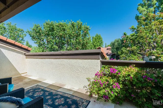 a view of a flower garden with a small yard