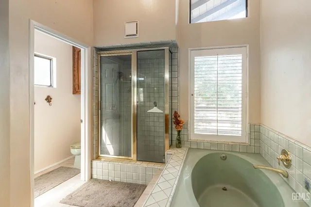 a bathroom with a granite countertop sink a large mirror and vanity