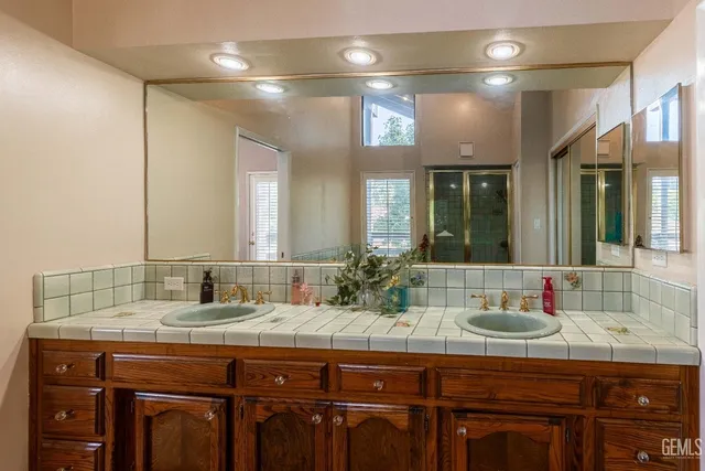a view of staircase with wooden floor and chair