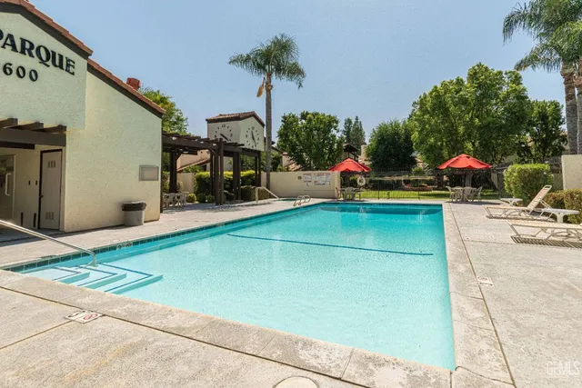a patio with a table and chairs