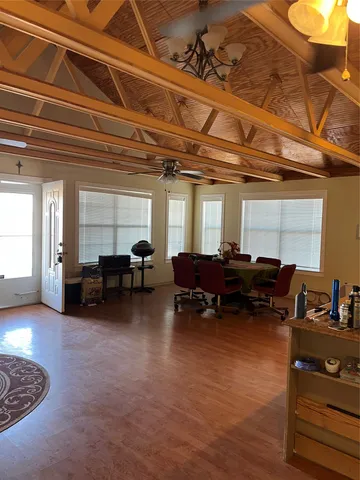 a living room with lots of furniture and a rug