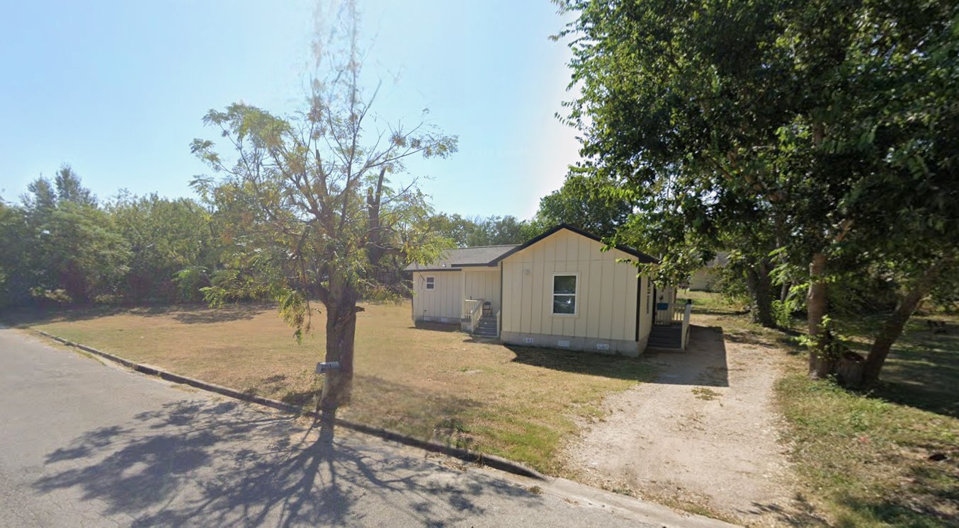 904 East Austin Street Luling, TX 78648 - Photo 11 of 12 View of front of house featuring board and batten siding.