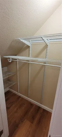 a view of an empty walk in closet