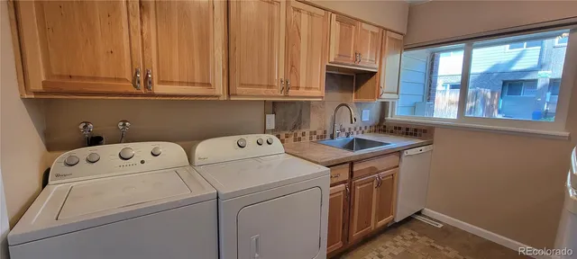 a utility room with dryer and washer