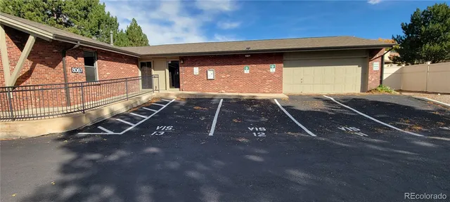 a view of a patio with table and chairs and potted plants