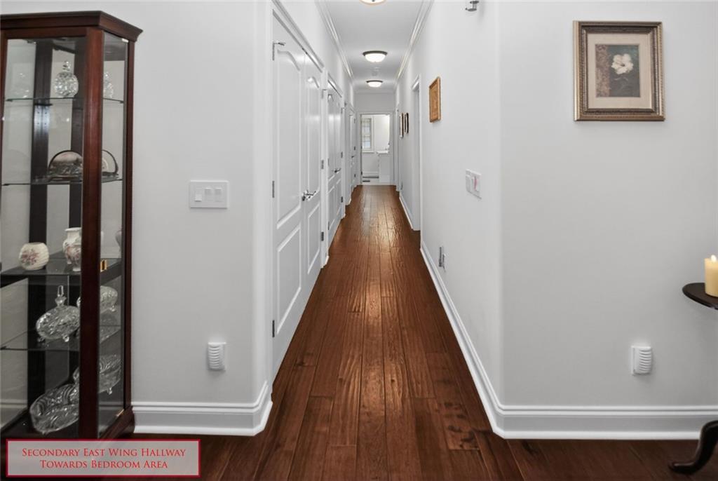 4113 Ledan Extension Gainesville, GA 30506 - Photo 102 of 195 a view of a hallway with wooden floor and staircase