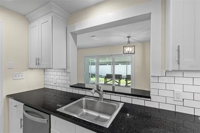 a bathroom with a sink and a window