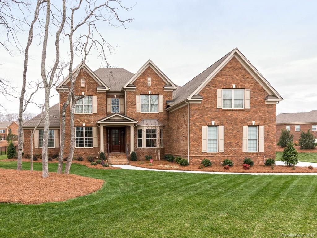 7005 Tea Olive Road Marvin, NC 28173 - Photo 1 of 24 a front view of a house with a yard