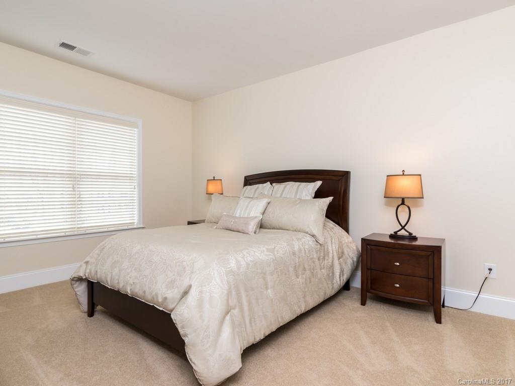 7005 Tea Olive Road Marvin, NC 28173 - Photo 14 of 24 a bedroom with a bed and window