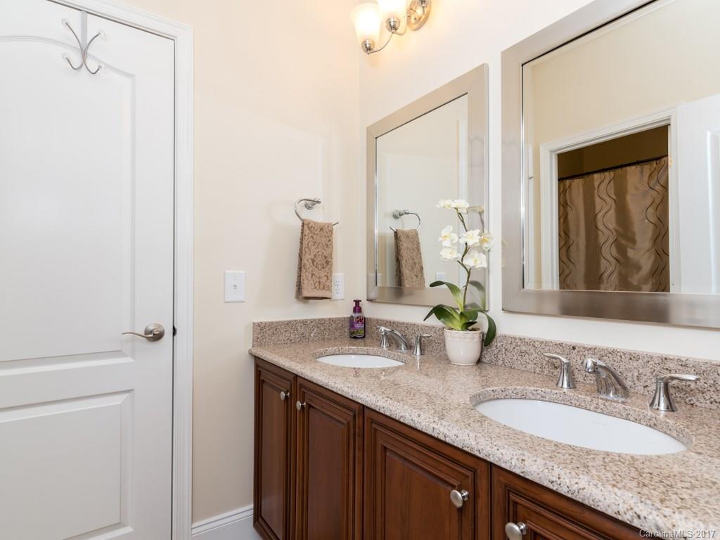 7005 Tea Olive Road Marvin, NC 28173 - Photo 16 of 24 a bathroom with a granite countertop double vanity sink and a mirror