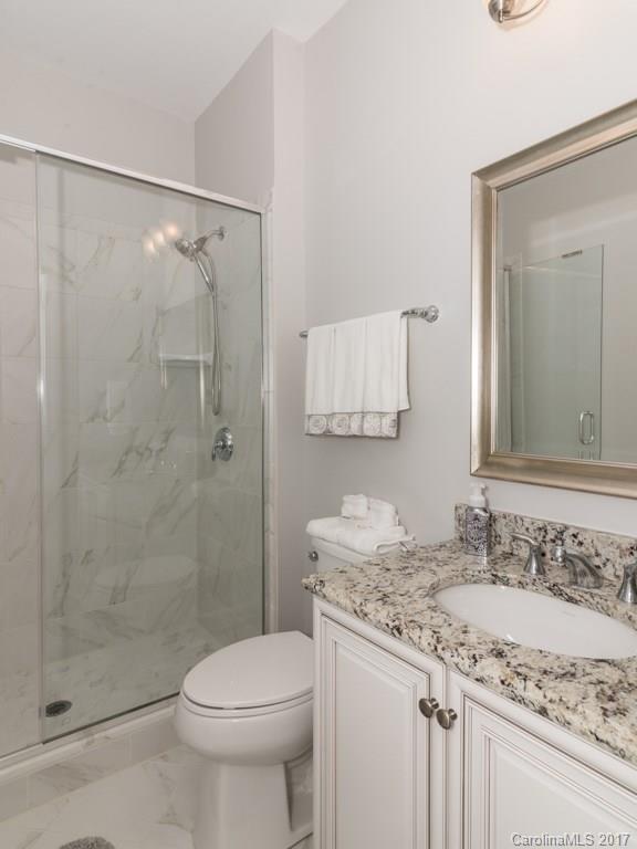 7005 Tea Olive Road Marvin, NC 28173 - Photo 18 of 24 a bathroom with a granite countertop sink toilet and shower