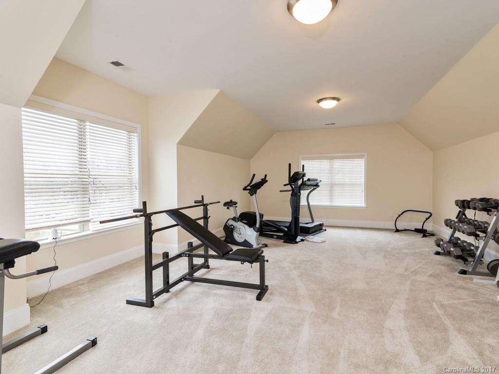 7005 Tea Olive Road Marvin, NC 28173 - Photo 20 of 24 a view of a room with gym equipment and windows