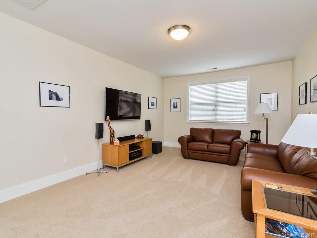 7005 Tea Olive Road Marvin, NC 28173 - Photo 21 of 24 a living room with furniture and a flat screen tv