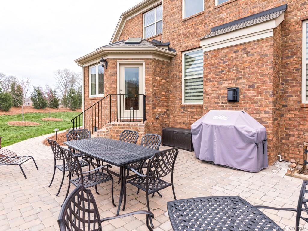 7005 Tea Olive Road Marvin, NC 28173 - Photo 22 of 24 a view of a patio with a table and chairs