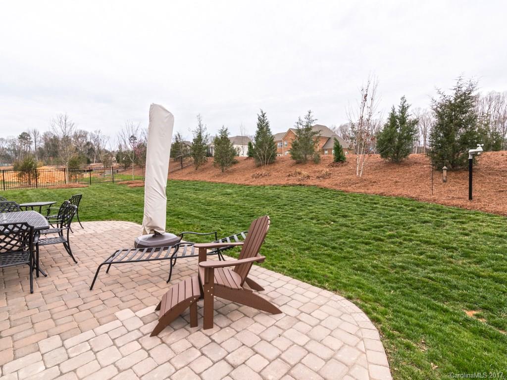 7005 Tea Olive Road Marvin, NC 28173 - Photo 24 of 24 a view of a patio with a table chairs and a table