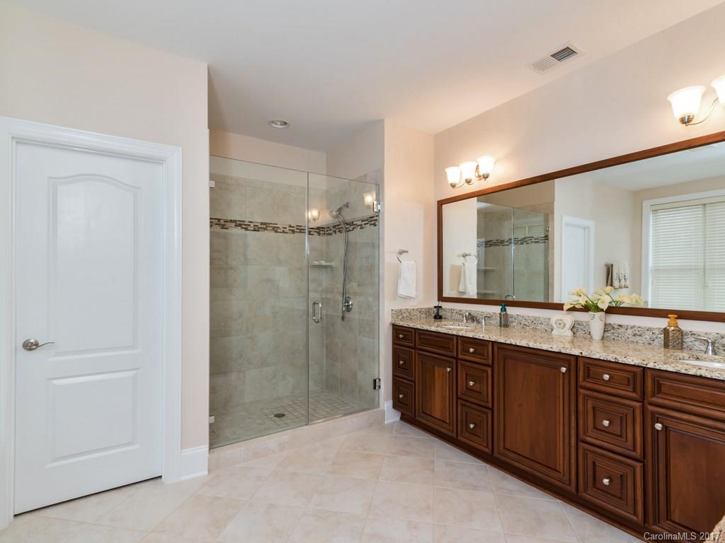 7005 Tea Olive Road Marvin, NC 28173 - Photo 10 of 24 a spacious bathroom with a granite countertop sink mirror and double