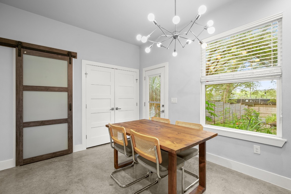 1220 Delano Street, Unit B Austin, TX 78721 - Photo 11 of 24 a view of a dining room with furniture and a chandelier
