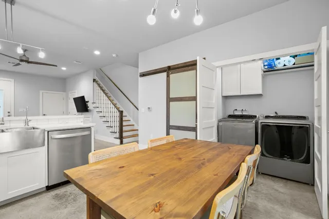 a kitchen with a stove a sink and a refrigerator