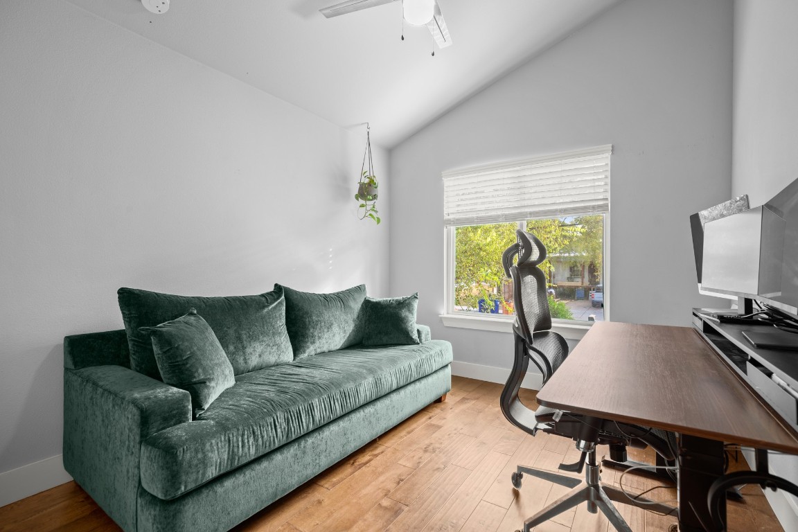 1220 Delano Street, Unit B Austin, TX 78721 - Photo 18 of 24 a living room with furniture a table and a large window