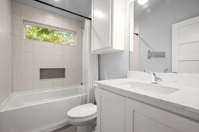 a bathroom with a sink a toilet and a bathtub