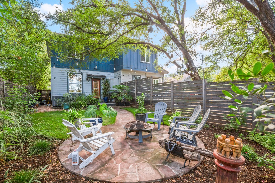 1220 Delano Street, Unit B Austin, TX 78721 - Photo 23 of 24 a view of a chair and table in backyard of the house