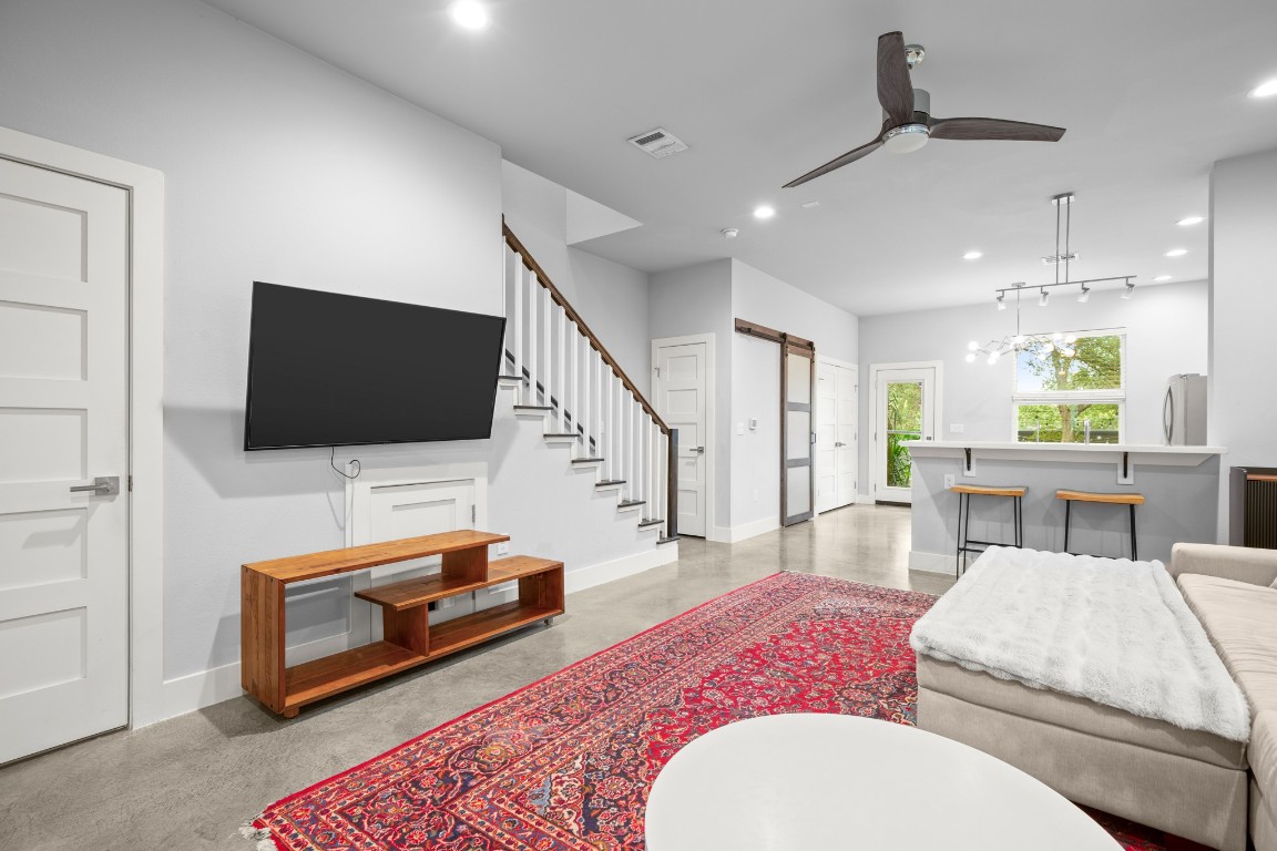1220 Delano Street, Unit B Austin, TX 78721 - Photo 3 of 24 a living room with furniture and a flat screen tv