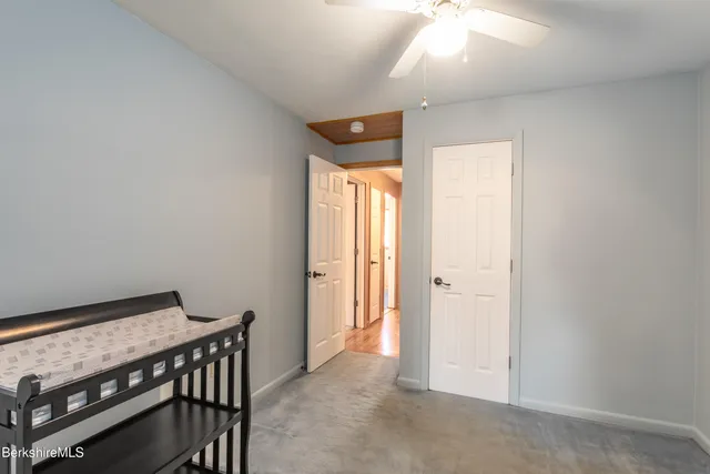 a view of a room with a table and chairs