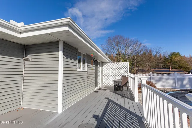 a view of a balcony with furniture