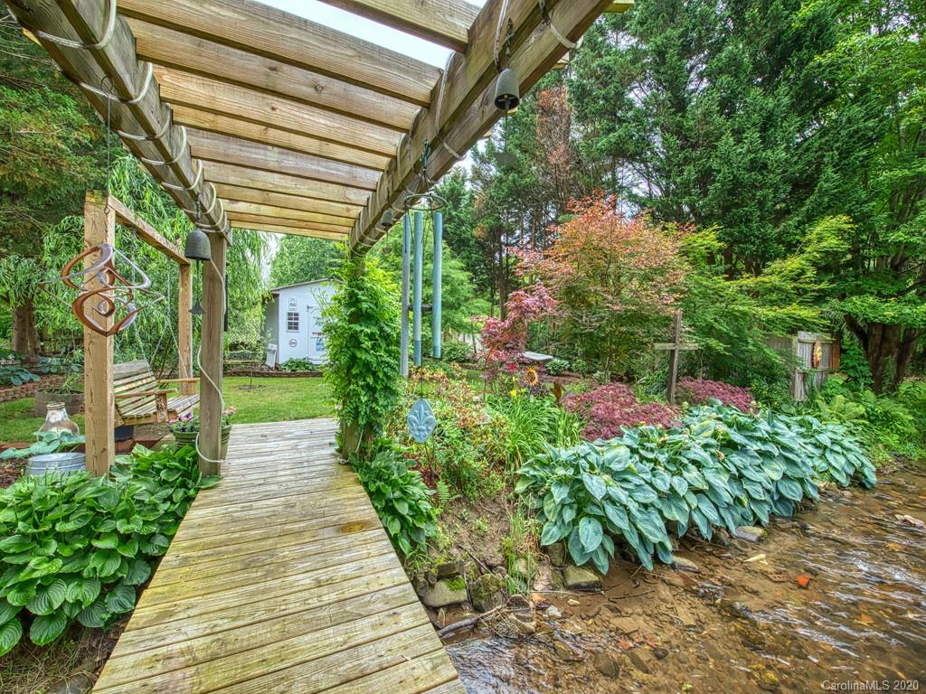 154 Camp Branch Road Waynesville, NC 28786 - Photo 11 of 29 a backyard of a house with lots of green space