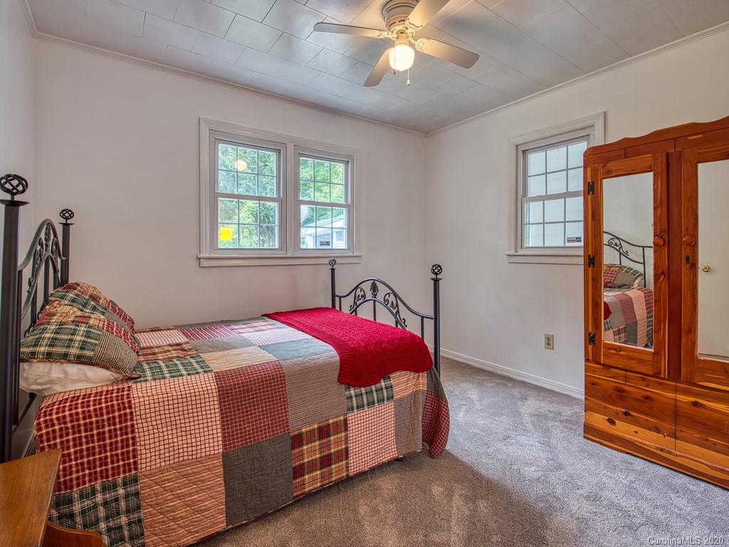 154 Camp Branch Road Waynesville, NC 28786 - Photo 27 of 29 a bedroom with a bed and window
