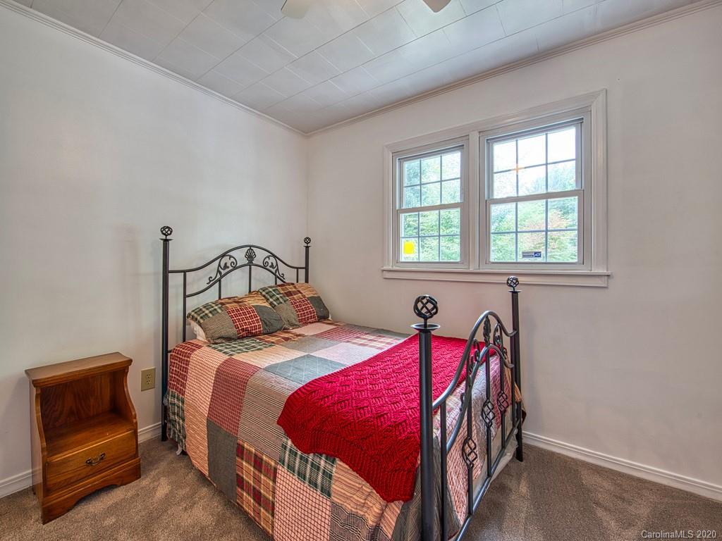 154 Camp Branch Road Waynesville, NC 28786 - Photo 28 of 29 a bedroom with a bed and a window