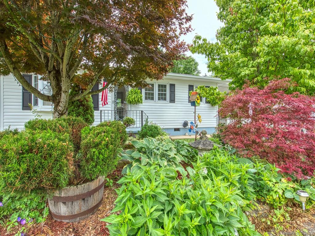 154 Camp Branch Road Waynesville, NC 28786 - Photo 4 of 29 a front view of a house with a garden