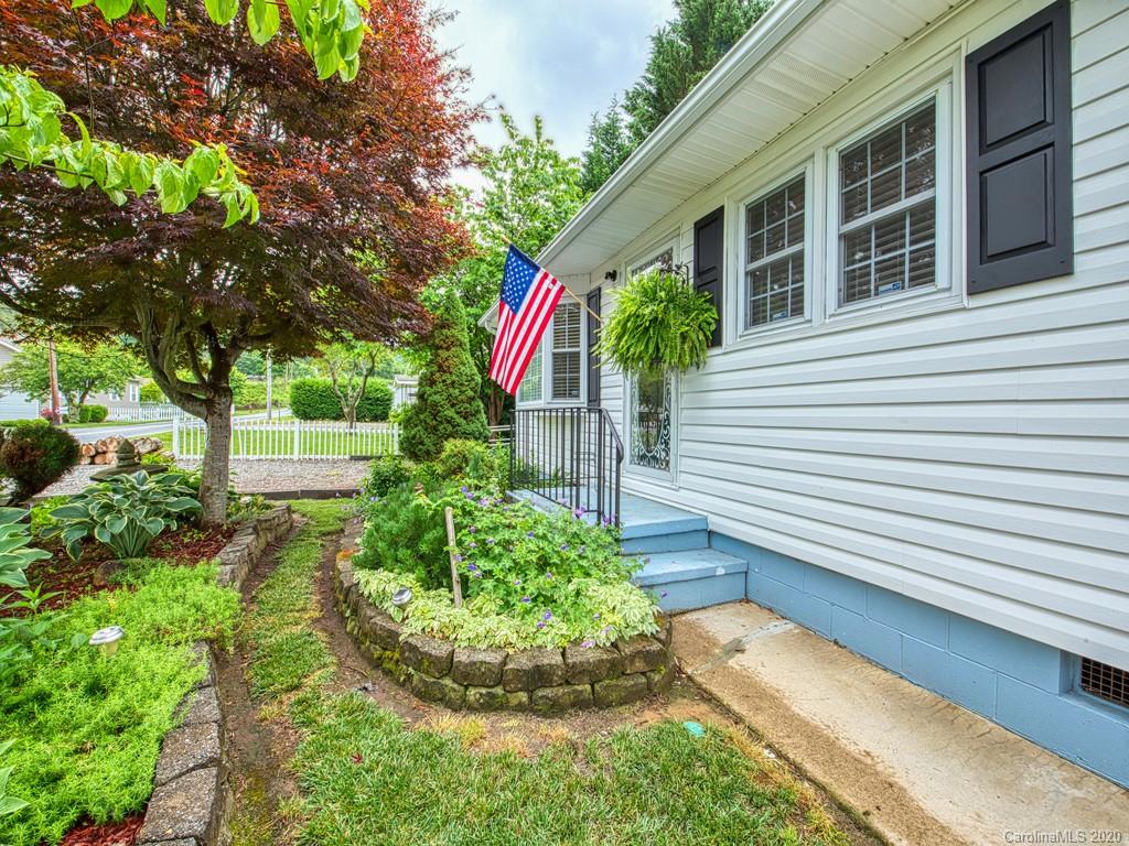 154 Camp Branch Road Waynesville, NC 28786 - Photo 6 of 29 a front view of a house with a yard