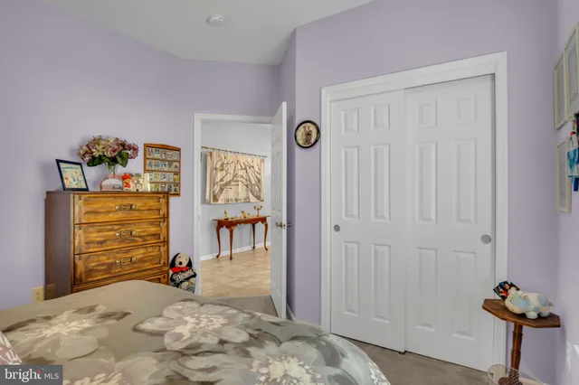 a view of a livingroom with wooden floor and closet