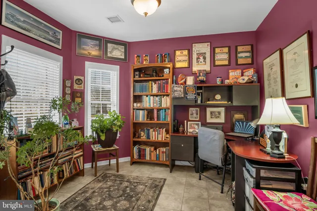 a view of a workspace with a window and cabinet