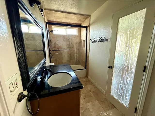 a view of balcony with wooden floor and fence