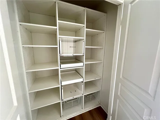 a kitchen with stainless steel appliances a stove microwave and sink