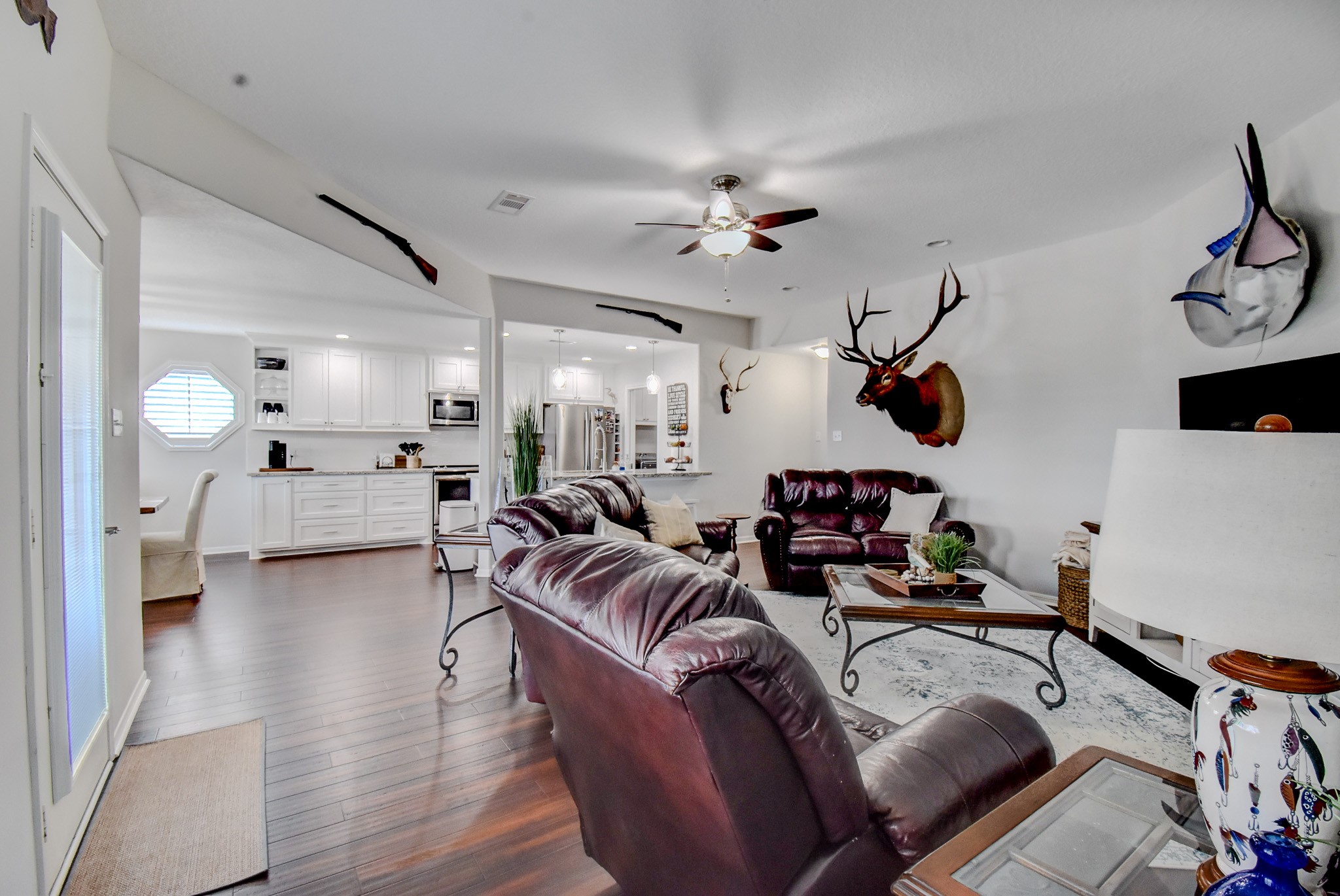 122 Four Master Road Freeport, TX 77541 - Photo 12 of 50 a living room with furniture and a flat screen tv