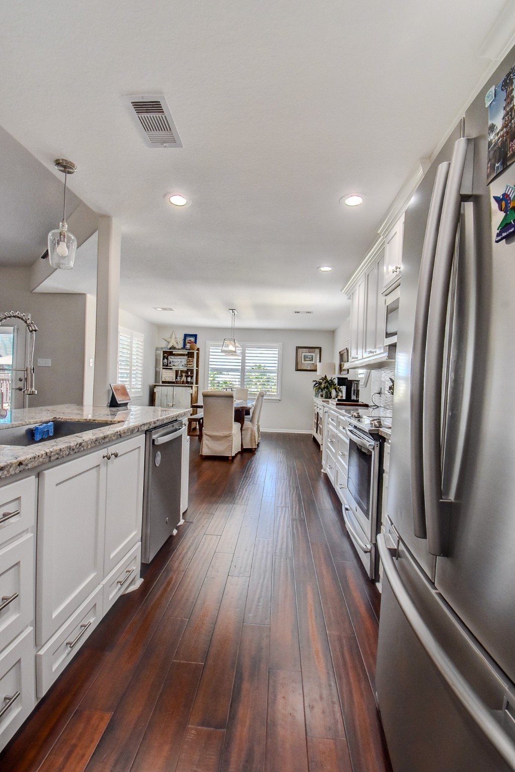 122 Four Master Road Freeport, TX 77541 - Photo 20 of 50 a kitchen with lots of counter top space and stainless steel appliances