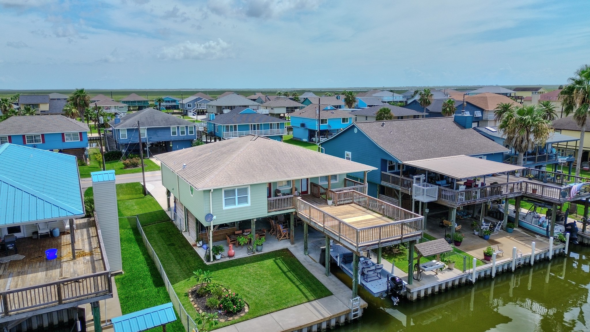122 Four Master Road Freeport, TX 77541 - Photo 2 of 50 an aerial view of a house with swimming pool and a yard