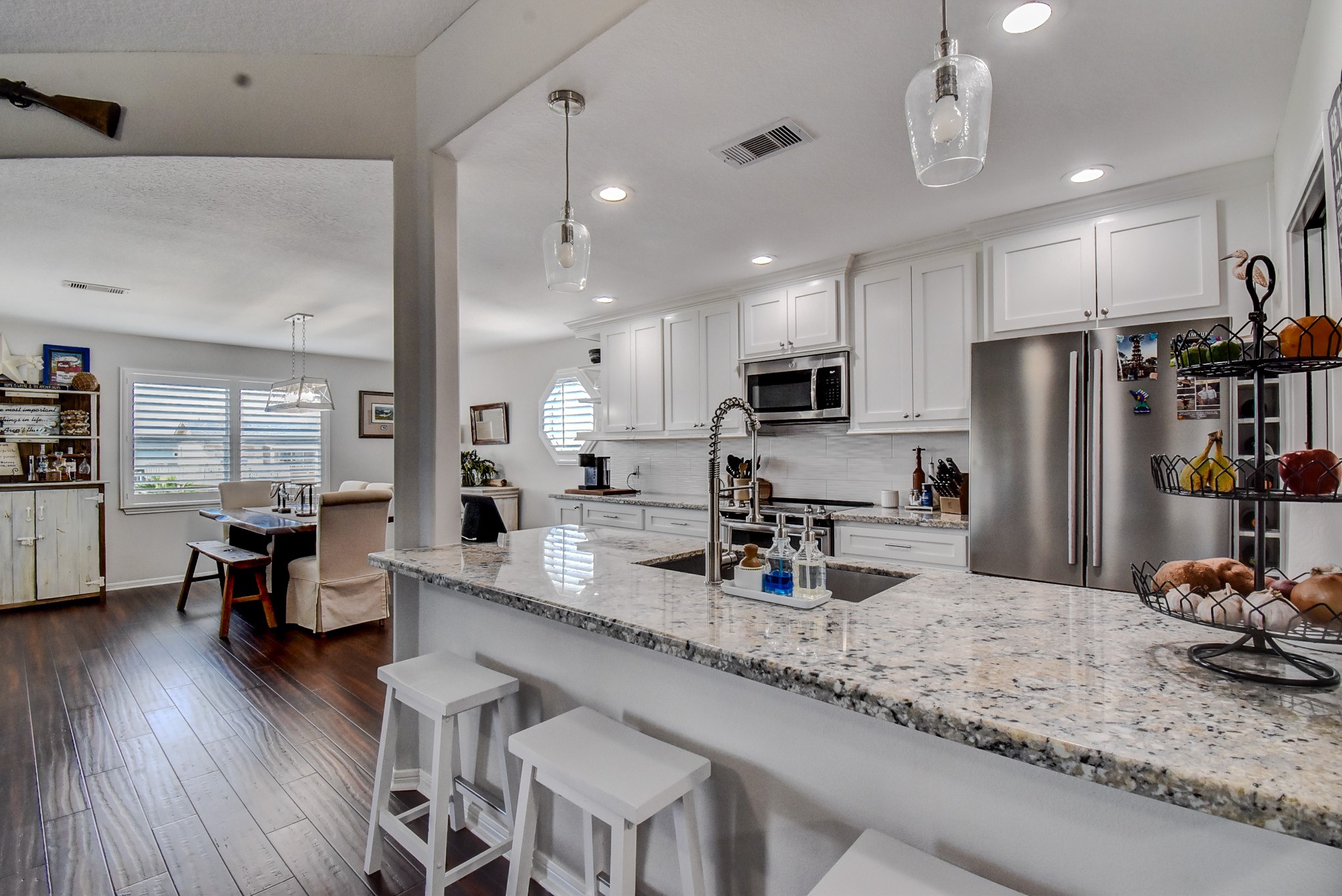122 Four Master Road Freeport, TX 77541 - Photo 23 of 50 a kitchen with stainless steel appliances granite countertop a sink refrigerator and microwave