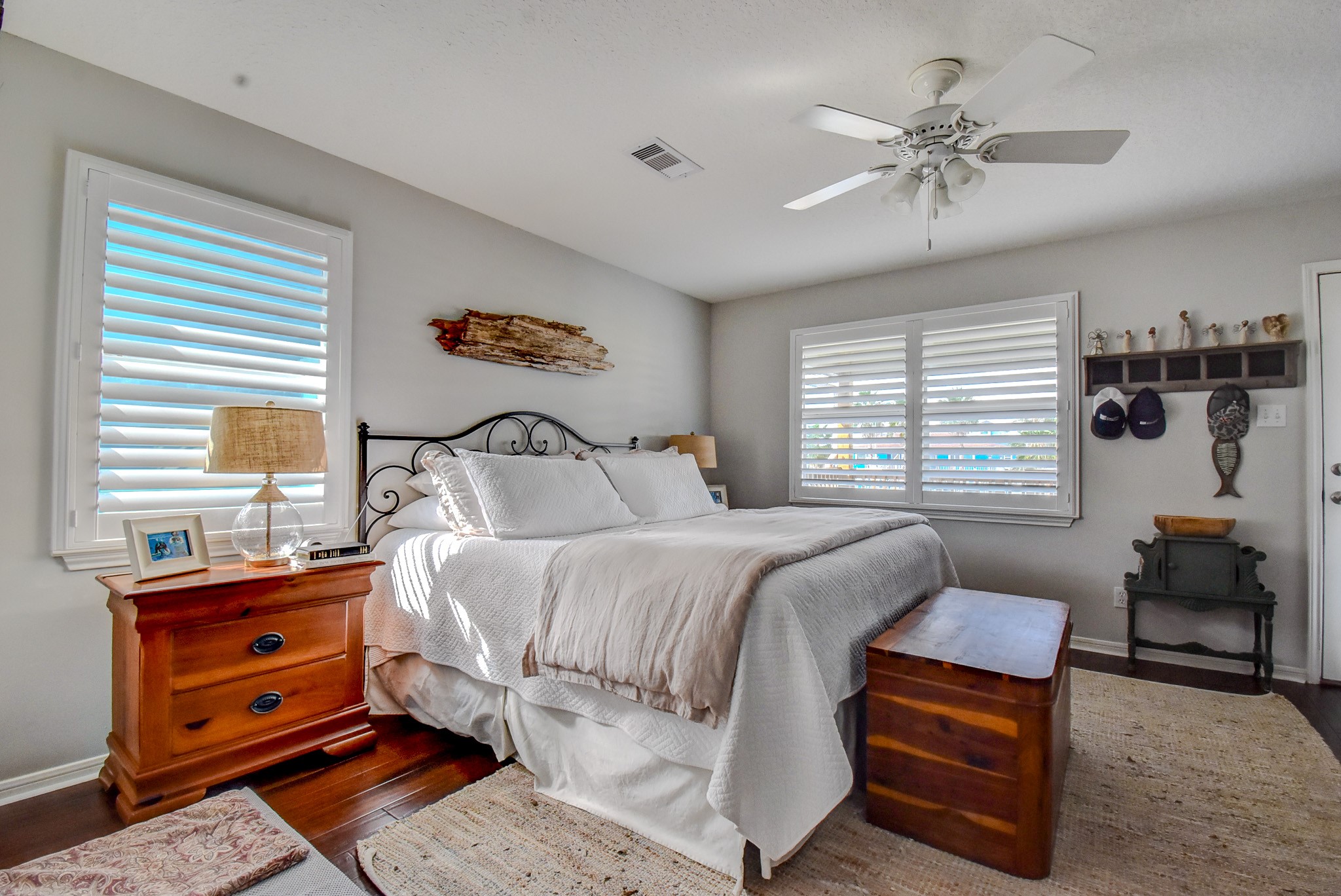 122 Four Master Road Freeport, TX 77541 - Photo 25 of 50 a bedroom with a bed and wooden floor