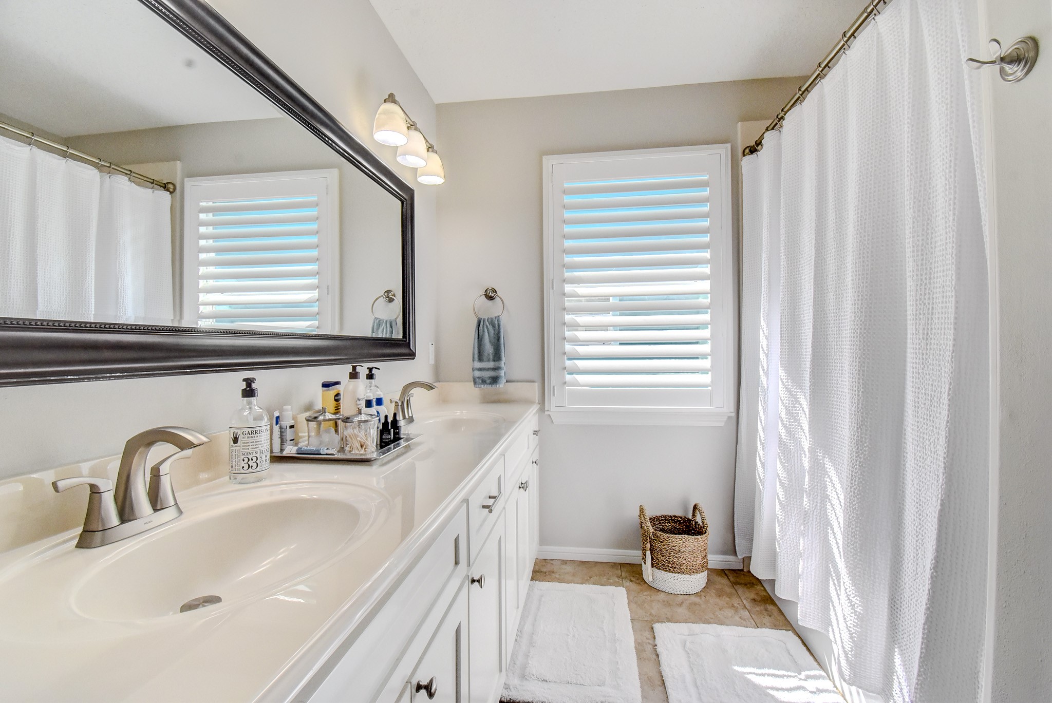 122 Four Master Road Freeport, TX 77541 - Photo 27 of 50 a bathroom with a sink a toilet and a mirror
