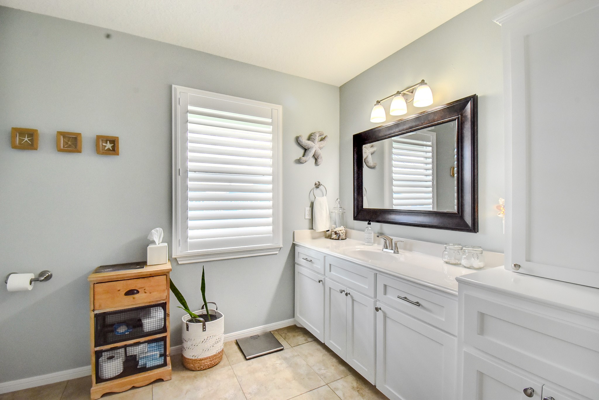 122 Four Master Road Freeport, TX 77541 - Photo 31 of 50 a bathroom with a sink mirror and a window