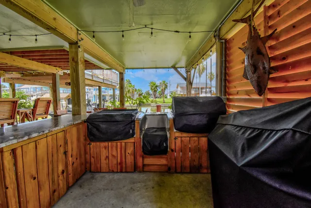 a view of a chairs and a table in the patio