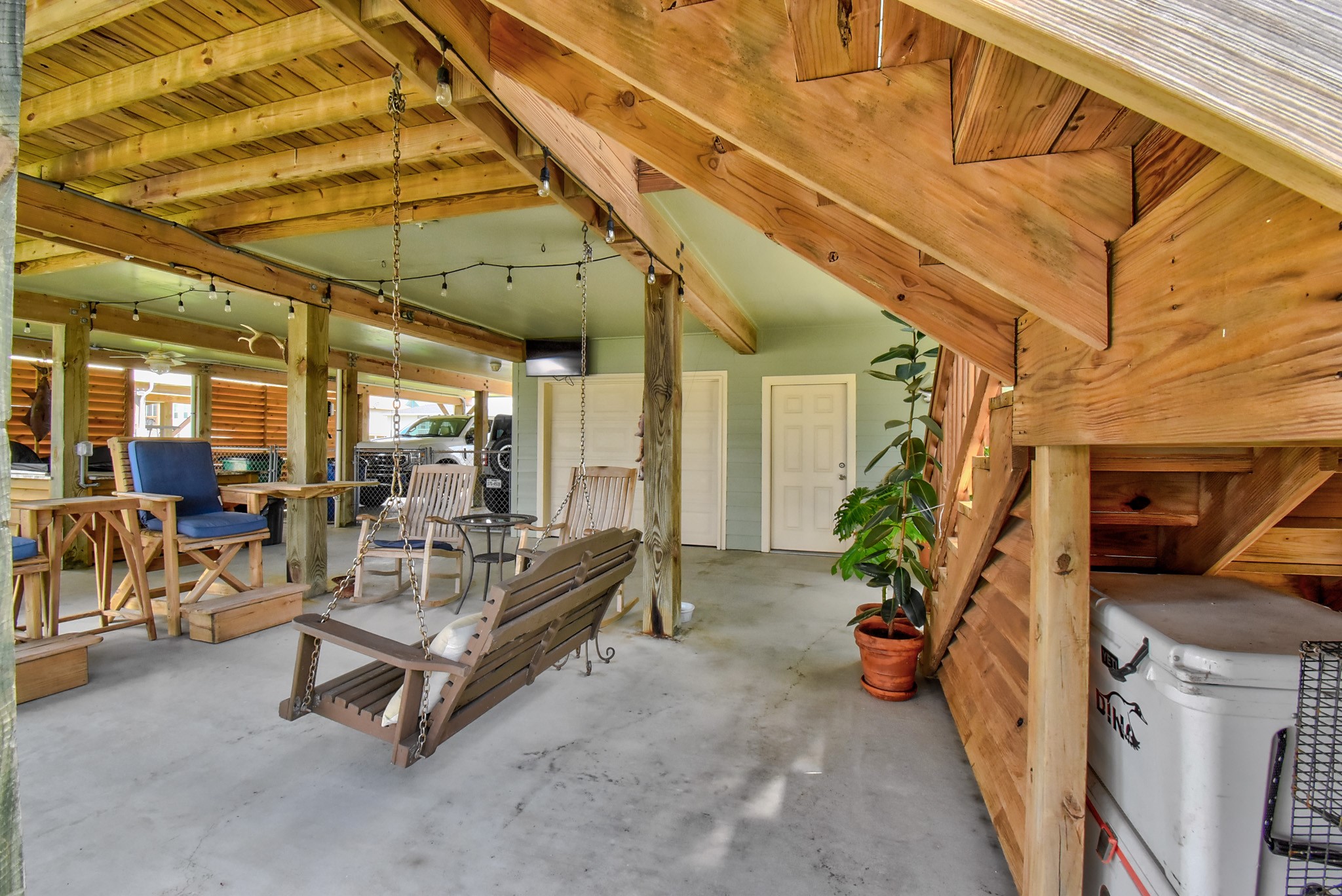 122 Four Master Road Freeport, TX 77541 - Photo 41 of 50 a view of a patio with table and chairs potted plants with wooden fence