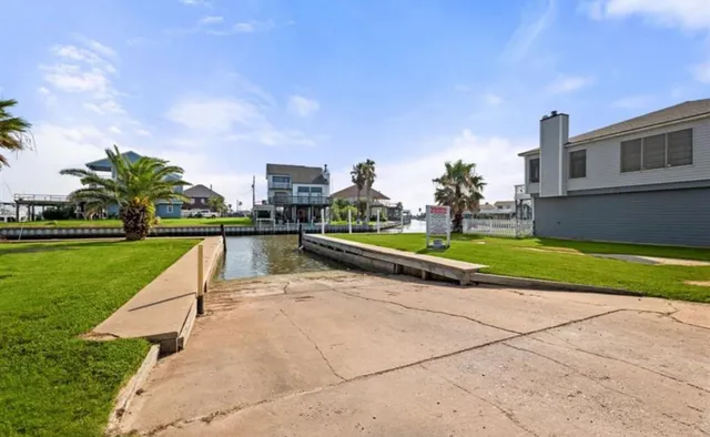a living room with stainless steel appliances kitchen island granite countertop furniture and a kitchen view