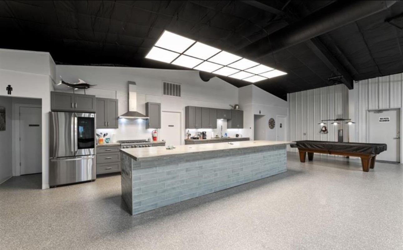 122 Four Master Road Freeport, TX 77541 - Photo 48 of 50 a living room with stainless steel appliances kitchen island granite countertop furniture and a kitchen view
