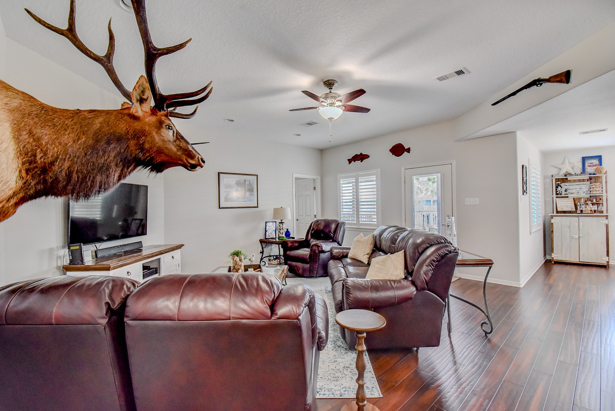 122 Four Master Road Freeport, TX 77541 - Photo 9 of 50 a living room with furniture and wooden floor